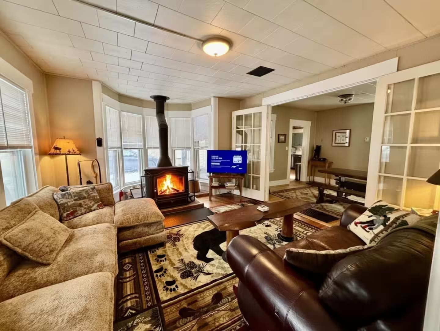 Living room with wood stove at 56 Main Street in Ludlow, Vermont